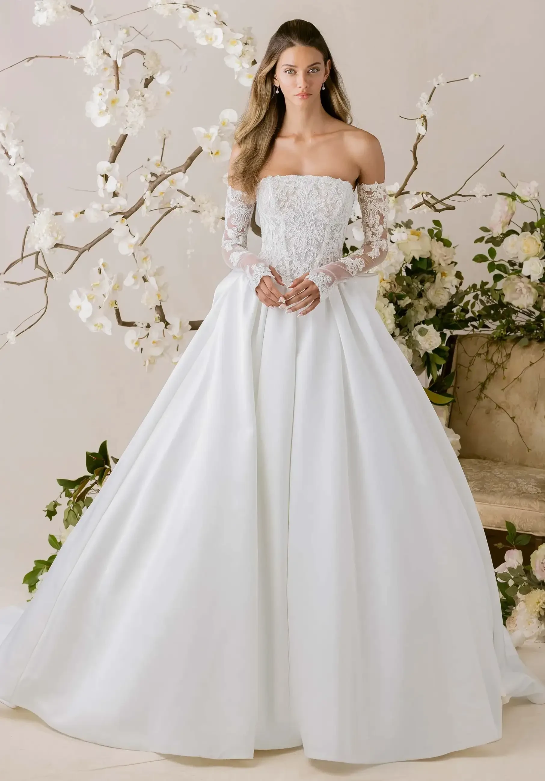 model is wearing a strapless ball gown