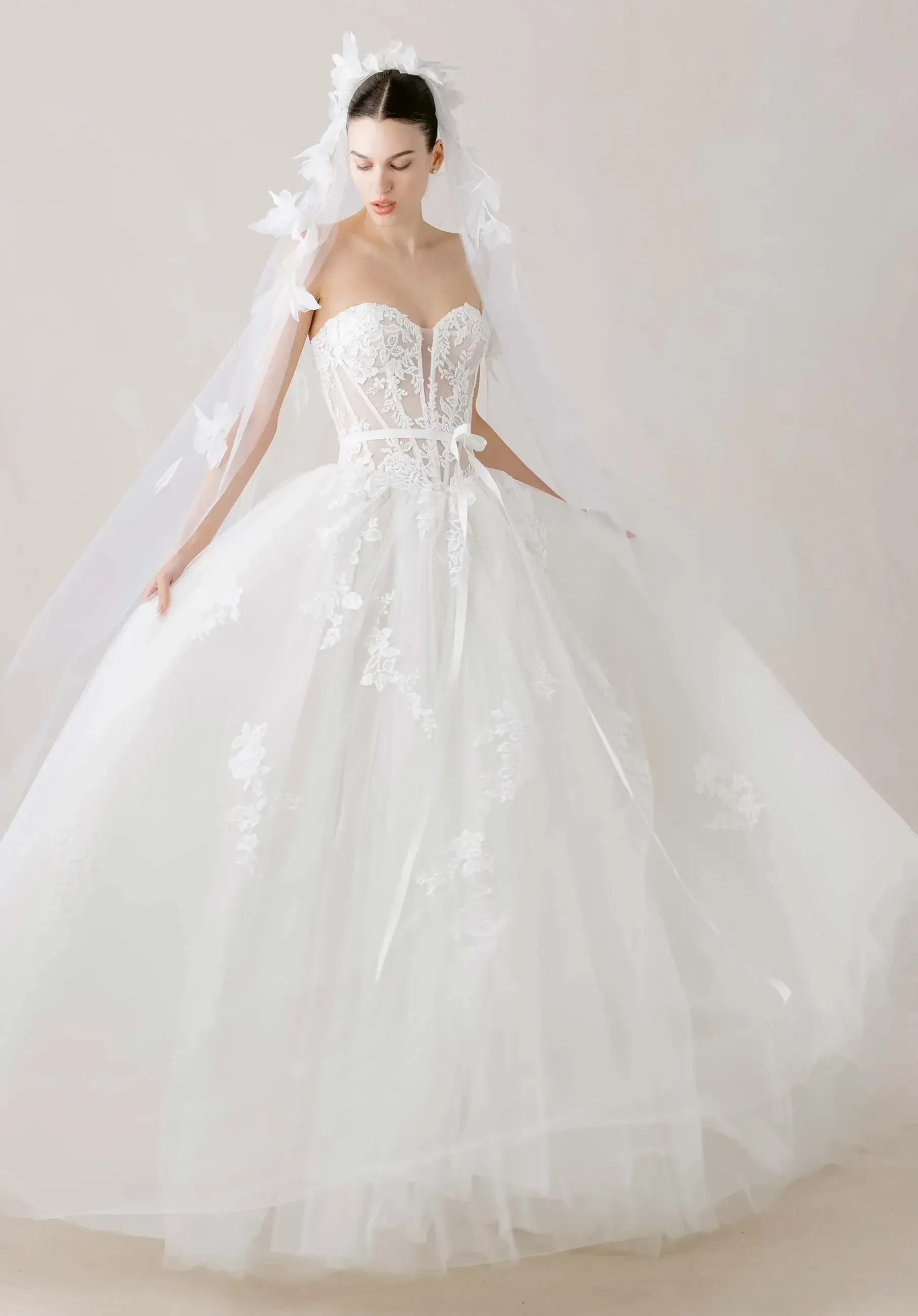 model is wearing a ball gown wedding dress