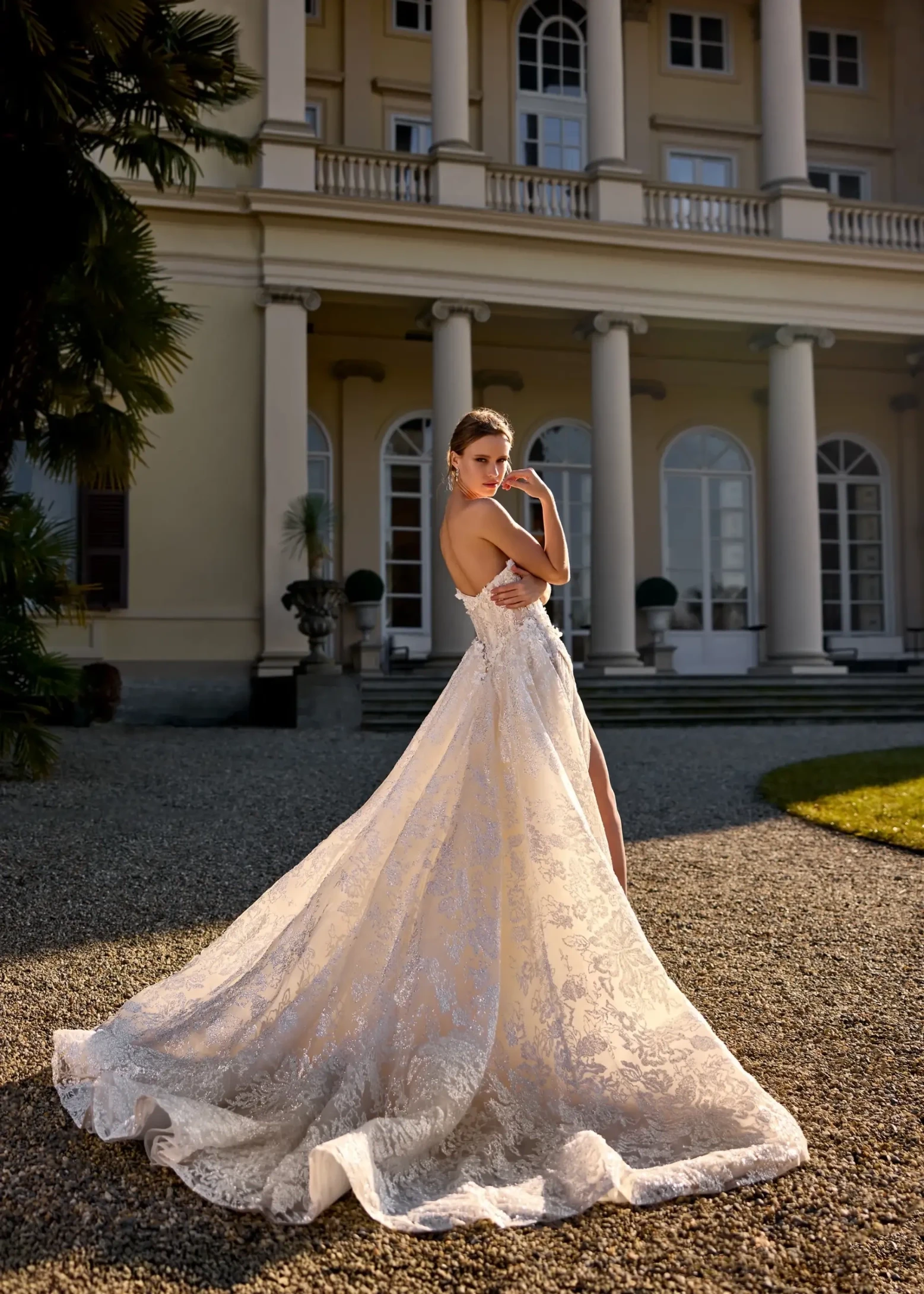 model is wearing a sleek randy fenoli wedding dress