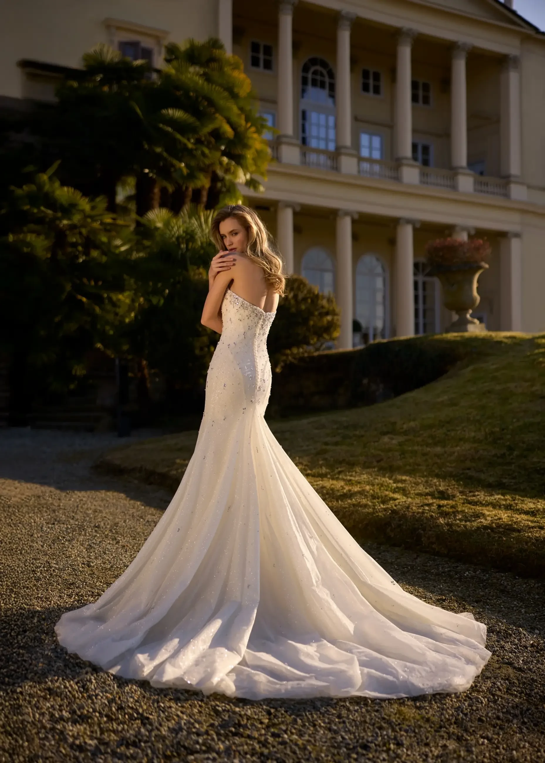 model wears a mermaid strapless wedding gown